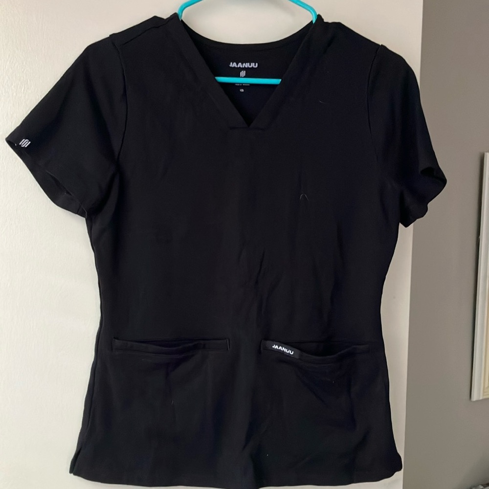 Jaanuu women’s scrub top. Size XS.